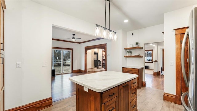 741 Riverside Rd, Holdingford, MN 56340 - kitchen with brown cabinetry, light countertops, open shelves, light wood-style floors, and recessed lighting