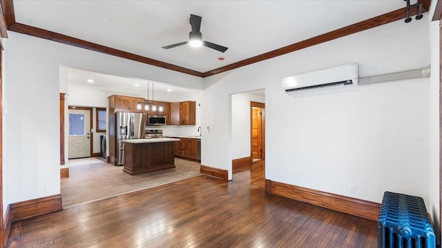 741 Riverside Rd, Holdingford, MN 56340 - kitchen featuring stainless steel appliances, a wall unit AC, hardwood / wood-style flooring, light countertops, and ceiling fan