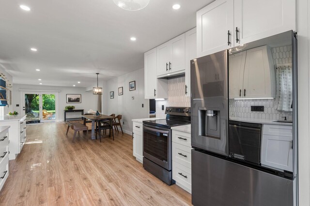 kitchen featuring recessed lighting, light countertops, tasteful backsplash, and stainless steel appliances