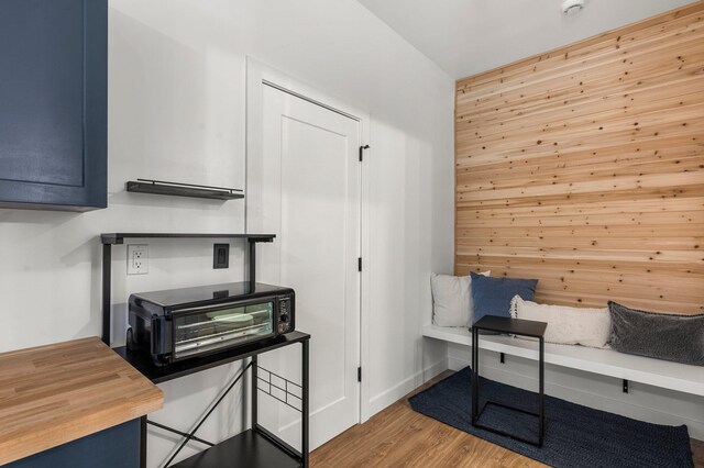 interior space with light wood-style floors and a toaster