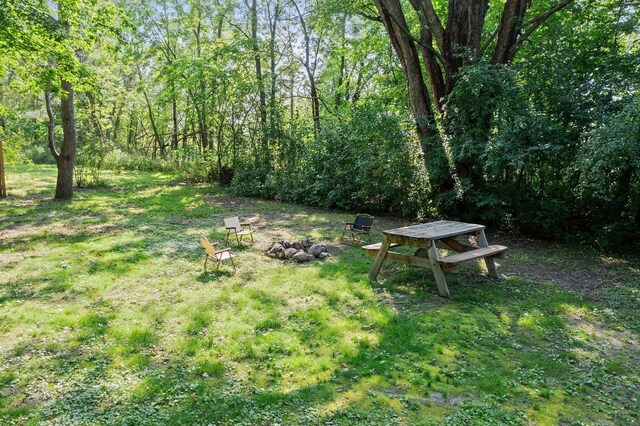 view of yard with a view of trees