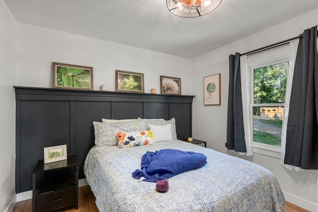 615 Clarence Ave, Minnetrista, MN 55364 - bedroom featuring baseboards and wood finished floors