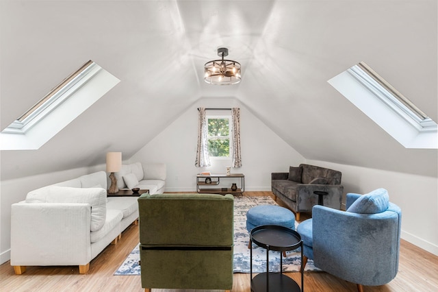 615 Clarence Ave, Minnetrista, MN 55364 - interior space featuring baseboards, light wood-style floors, and vaulted ceiling with skylight