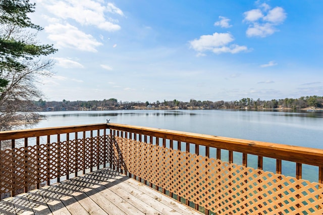 wooden deck featuring a water view
