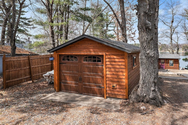 view of outdoor structure featuring an outdoor structure and fence