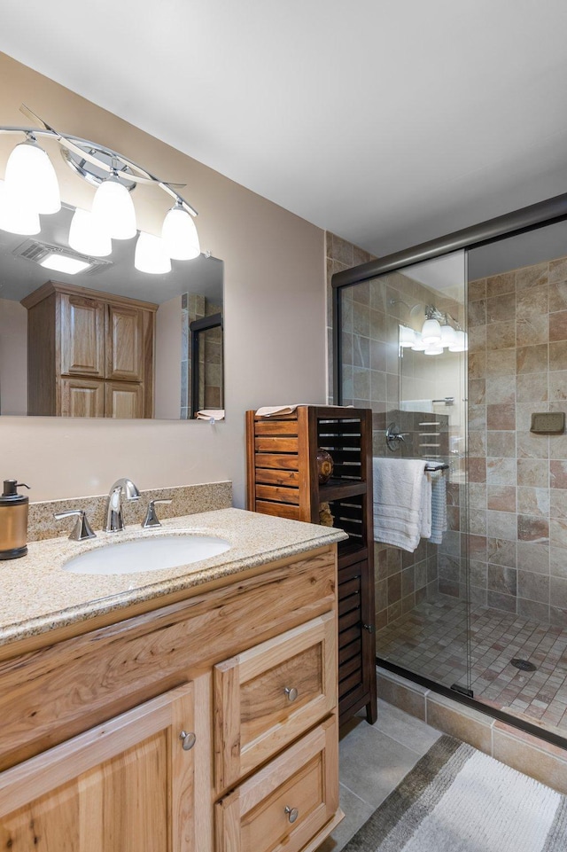 full bathroom with vanity and a stall shower