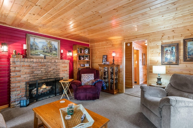 living area featuring wood ceiling, carpet floors, a brick fireplace, and wooden walls