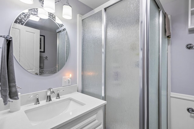 bathroom with vanity and a stall shower