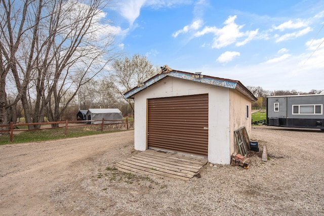 garage with fence