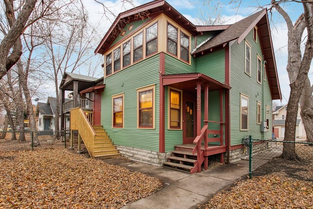 2733 Columbus Ave, Minneapolis, MN 55407 - view of front of house featuring a fenced backyard and roof with shingles