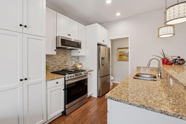 17785 Valley Cove Ct, Minnetonka, MN 55345 - kitchen with stainless steel appliances, a sink, white cabinetry, recessed lighting, and tasteful backsplash