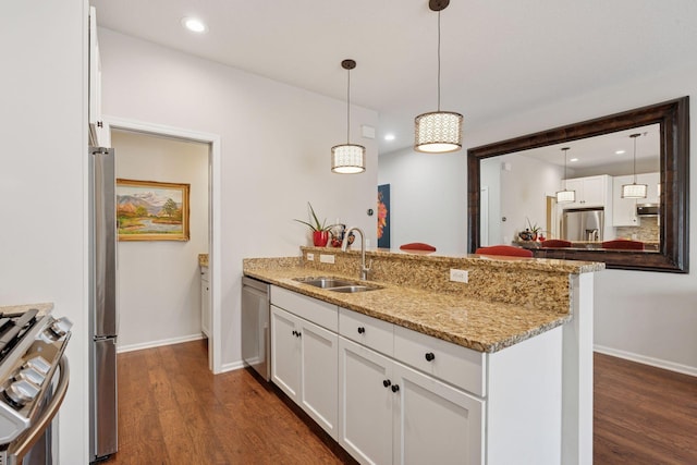 17785 Valley Cove Ct, Minnetonka, MN 55345 - kitchen with a sink, stainless steel appliances, a peninsula, dark wood-style floors, and baseboards