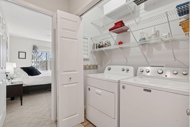 17785 Valley Cove Ct, Minnetonka, MN 55345 - washroom featuring washing machine and dryer and light carpet
