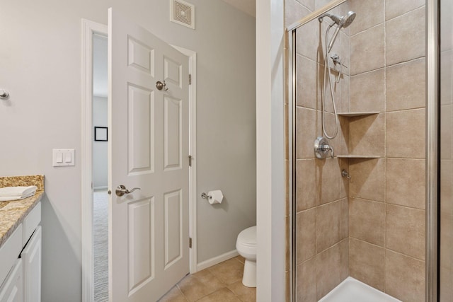 17785 Valley Cove Ct, Minnetonka, MN 55345 - bathroom with vanity, a stall shower, tile patterned floors, toilet, and baseboards