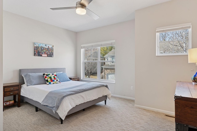 17785 Valley Cove Ct, Minnetonka, MN 55345 - bedroom featuring multiple windows, carpet, ceiling fan, and baseboards