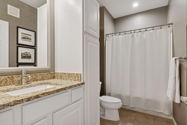 17785 Valley Cove Ct, Minnetonka, MN 55345 - bathroom with toilet, vanity, tile patterned floors, and shower / bath combination with curtain