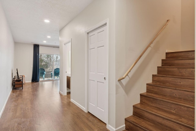 17785 Valley Cove Ct, Minnetonka, MN 55345 - stairs featuring wood finished floors, baseboards, and recessed lighting