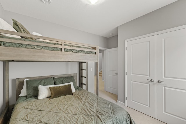 bedroom with a closet and carpet