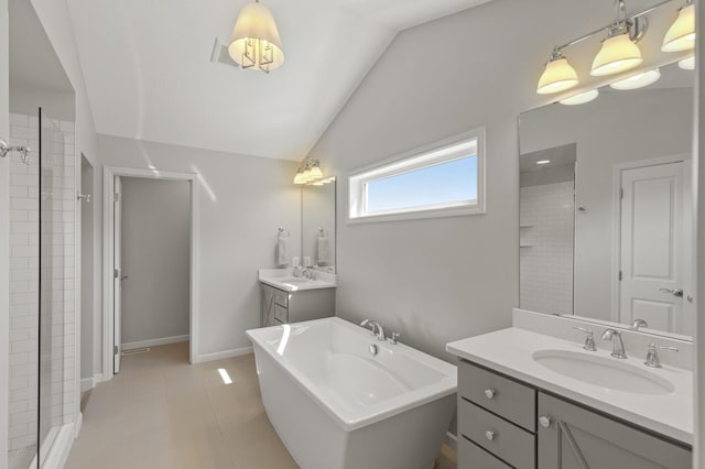 9195 Eagle Ridge Rd, Chanhassen, MN 55317 - bathroom with lofted ceiling, a soaking tub, two vanities, a shower stall, and baseboards