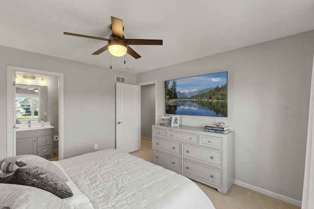 9195 Eagle Ridge Rd, Chanhassen, MN 55317 - bedroom with light carpet, baseboards, ensuite bath, and a ceiling fan