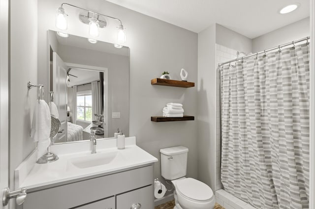 9195 Eagle Ridge Rd, Chanhassen, MN 55317 - ensuite bathroom featuring vanity, toilet, and a tile shower
