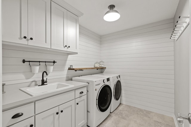 9195 Eagle Ridge Rd, Chanhassen, MN 55317 - laundry area with washing machine and clothes dryer, cabinet space, and wood walls