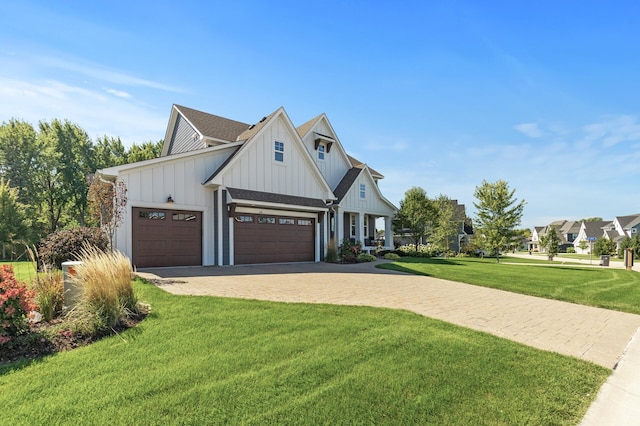 9195 Eagle Ridge Rd, Chanhassen, MN 55317 - modern inspired farmhouse with board and batten siding, a front yard, a garage, driveway, and roof with shingles