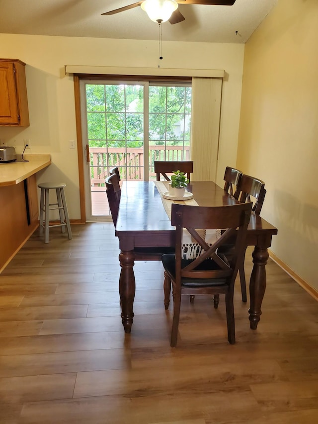 1874 Niagara St, Waconia, MN 55387 - dining room with ceiling fan, light wood-style floors, and baseboards