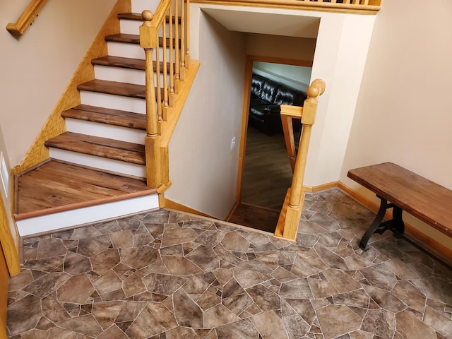 1874 Niagara St, Waconia, MN 55387 - stairs with baseboards and stone finish floors