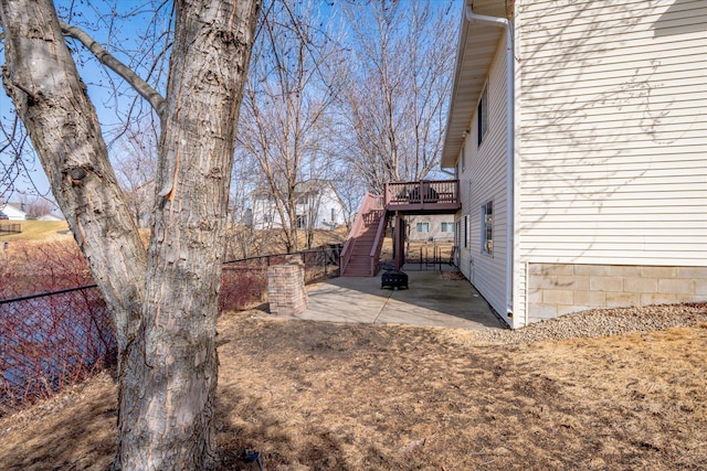 1874 Niagara St, Waconia, MN 55387 - view of side of home featuring stairs, a patio area, and a deck
