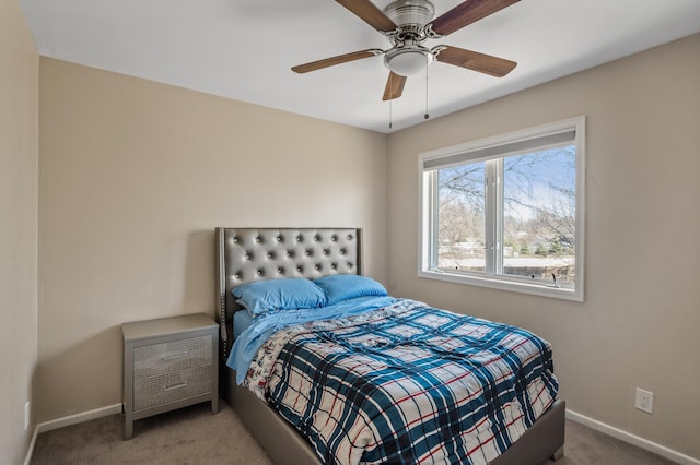 carpeted bedroom with baseboards and a ceiling fan