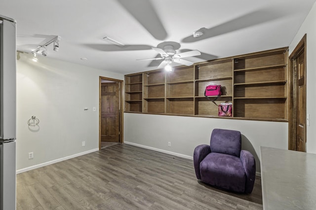unfurnished room with visible vents, baseboards, ceiling fan, and wood finished floors