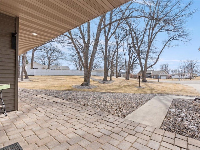 view of patio / terrace featuring fence