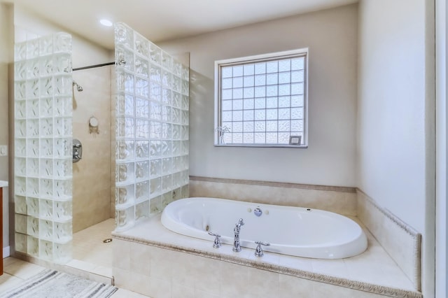 full bathroom featuring a garden tub and a walk in shower
