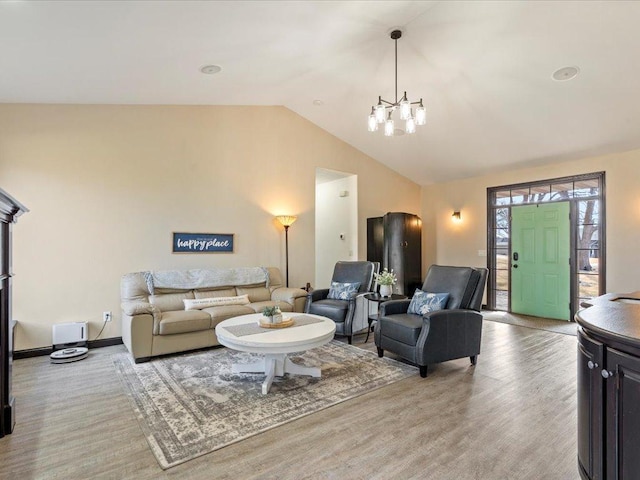46747 Poss Beach Rd, Pelican Rapids, MN 56572 - living area with a chandelier, lofted ceiling, light wood-type flooring, and arched walkways