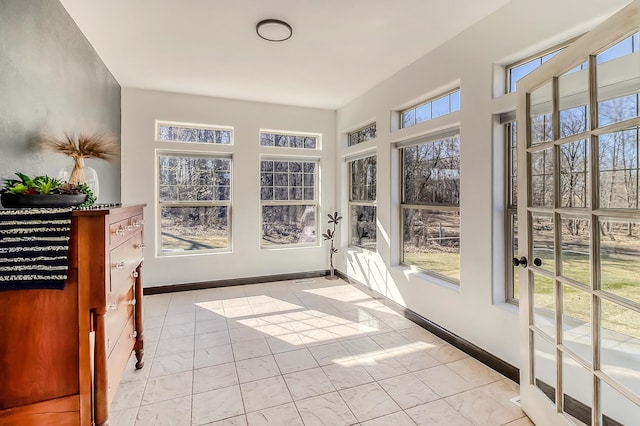 46747 Poss Beach Rd, Pelican Rapids, MN 56572 - unfurnished sunroom featuring baseboards and french doors
