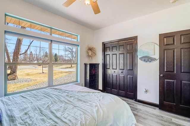 46747 Poss Beach Rd, Pelican Rapids, MN 56572 - bedroom with light wood-style flooring and a ceiling fan
