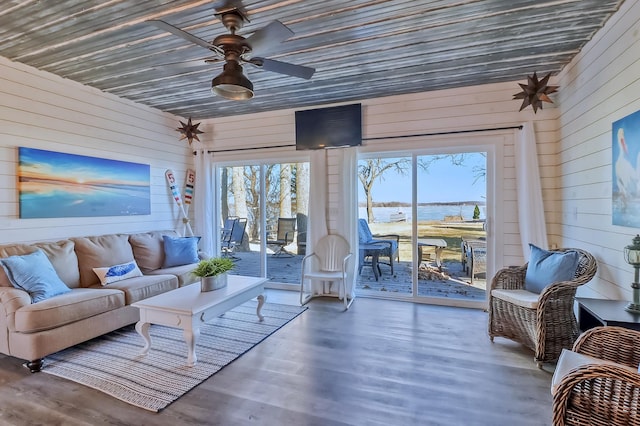 46747 Poss Beach Rd, Pelican Rapids, MN 56572 - living room with wooden walls, a ceiling fan, and wood finished floors