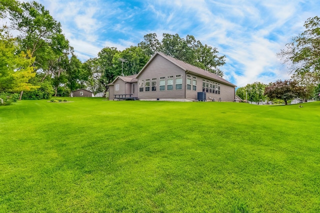 46747 Poss Beach Rd, Pelican Rapids, MN 56572 - rear view of house featuring a lawn, crawl space, and view of wooded area