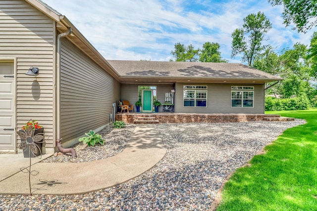 46747 Poss Beach Rd, Pelican Rapids, MN 56572 - back of property with a porch, roof with shingles, and an attached garage