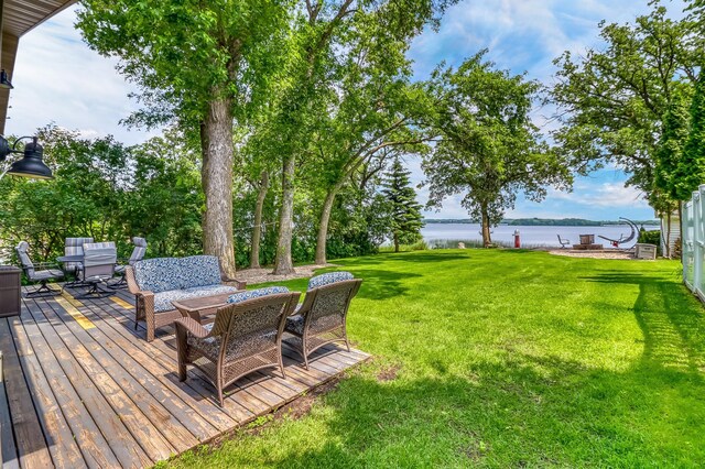 46747 Poss Beach Rd, Pelican Rapids, MN 56572 - view of grassy yard with a deck with water view and an outdoor hangout area