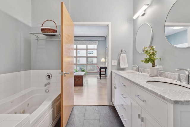 2840 Bryant Ave S Unit E302, Minneapolis, MN 55408 - ensuite bathroom featuring double vanity and a jetted tub