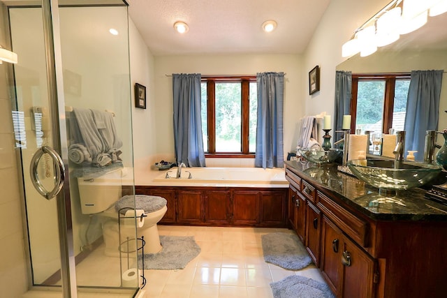 13720 Georgia Dr, Apple Valley, MN 55124 - bathroom featuring vanity, tile patterned floors, a stall shower, and a garden tub