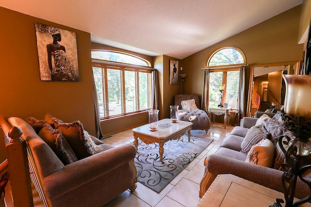 13720 Georgia Dr, Apple Valley, MN 55124 - living area featuring vaulted ceiling, healthy amount of natural light, and light tile patterned flooring