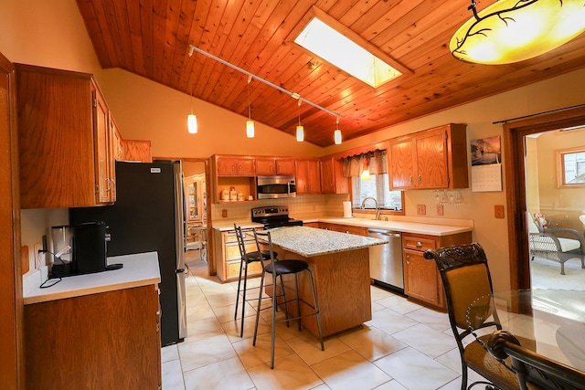 13720 Georgia Dr, Apple Valley, MN 55124 - kitchen with stainless steel appliances, lofted ceiling, light countertops, wood ceiling, and decorative backsplash