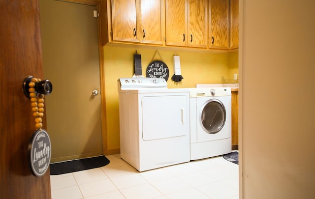13720 Georgia Dr, Apple Valley, MN 55124 - laundry area featuring washing machine and clothes dryer and cabinet space