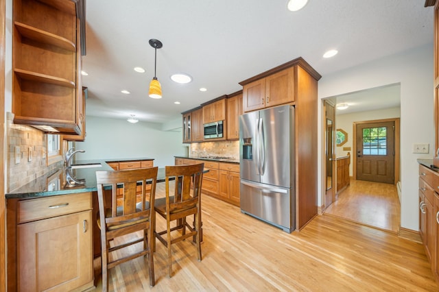 11413 Christansen Ct, Burnsville, MN 55337 - kitchen featuring appliances with stainless steel finishes, light wood finished floors, backsplash, a sink, and open shelves