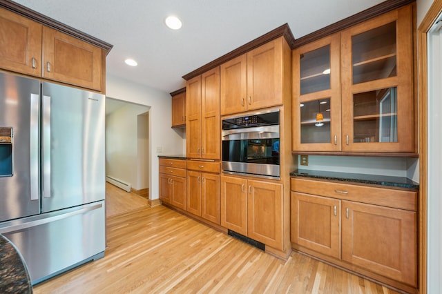 11413 Christansen Ct, Burnsville, MN 55337 - kitchen with appliances with stainless steel finishes, a baseboard radiator, light wood-type flooring, recessed lighting, and glass insert cabinets