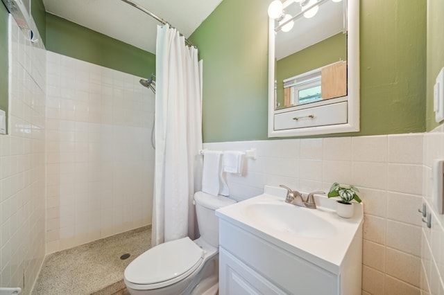 11413 Christansen Ct, Burnsville, MN 55337 - bathroom featuring toilet, a stall shower, vanity, tile walls, and a wainscoted wall