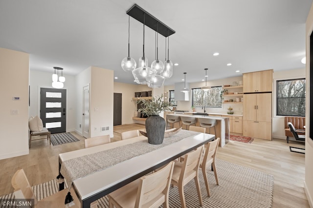 dining room featuring recessed lighting, baseboards, light wood-type flooring, and visible vents
